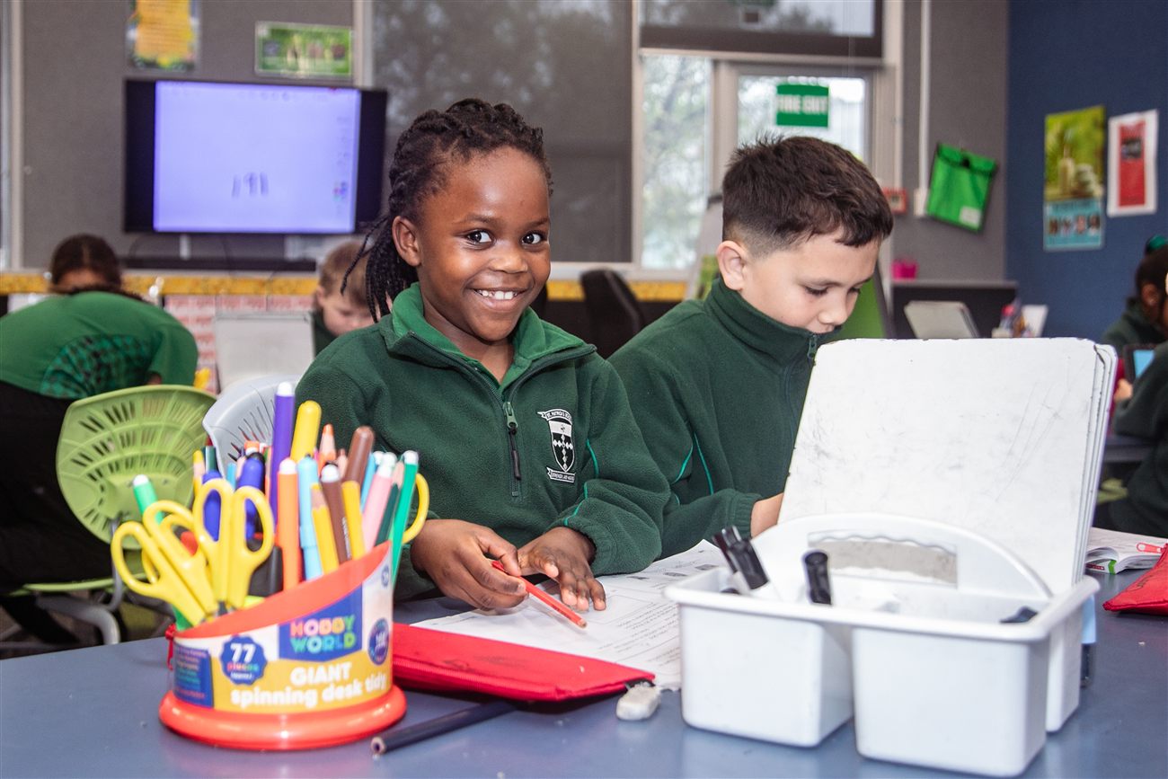 St Patrick's students at a table with craft supplies and colouring pens