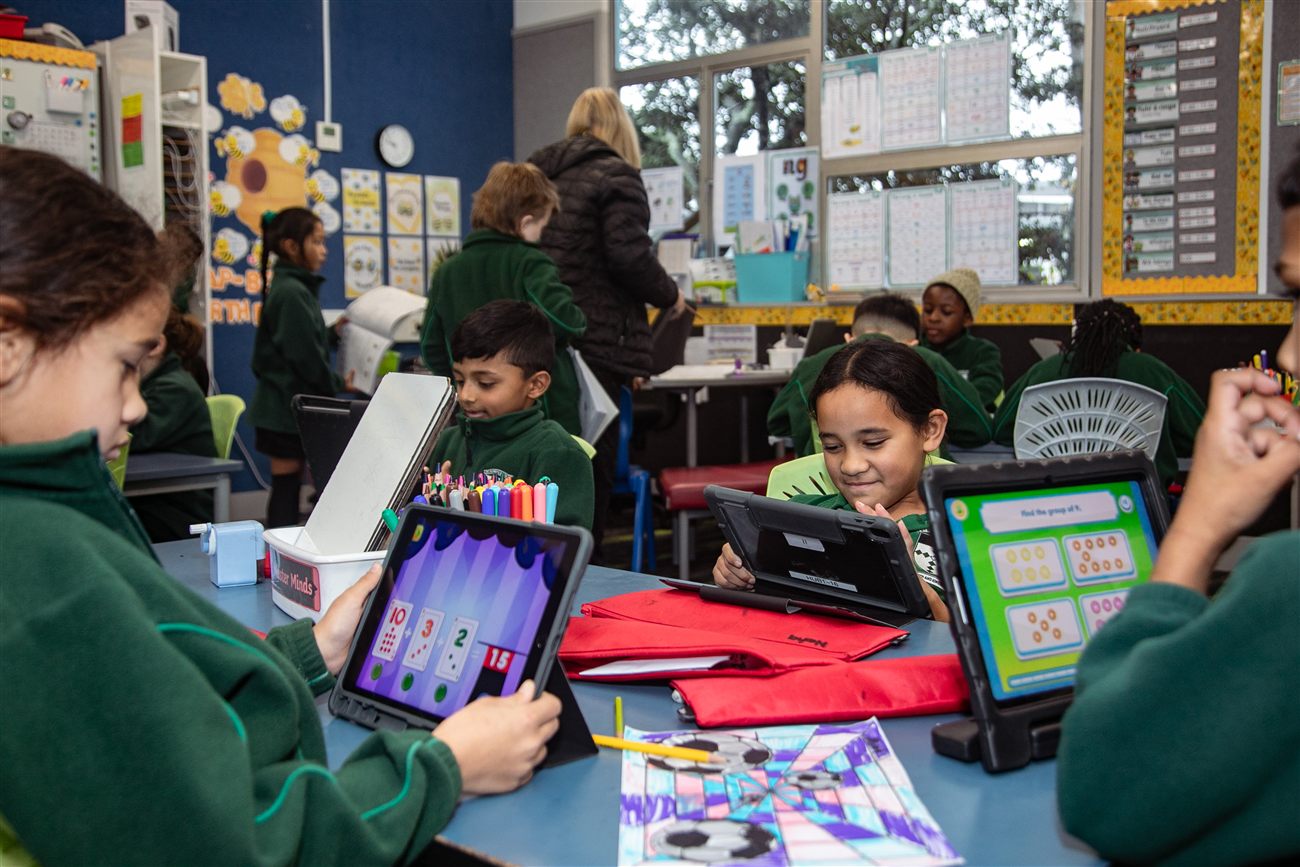 St Patrick's students using tablets together at their classroom desk